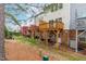 Back exterior view of townhomes with backyard decks and trees at 707 Sutter Gate Ln, Morrisville, NC 27560
