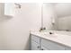 Bathroom featuring a white vanity with a sink, a large mirror, and neutral-colored walls at 707 Sutter Gate Ln, Morrisville, NC 27560