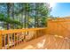 Backyard deck space with tall trees at 707 Sutter Gate Ln, Morrisville, NC 27560