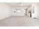 Large open-plan living room with a view into the kitchen and stairs to the second floor at 707 Sutter Gate Ln, Morrisville, NC 27560
