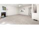 Spacious living room boasts a fireplace and large windows that bring in natural light at 707 Sutter Gate Ln, Morrisville, NC 27560