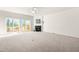 Bright living room with fireplace and sliding doors to the deck, perfect for entertaining at 707 Sutter Gate Ln, Morrisville, NC 27560