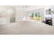 Bright, open living room with a fireplace, sliding glass doors to a deck, and neutral decor at 707 Sutter Gate Ln, Morrisville, NC 27560