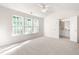 Spacious bedroom with large windows and an ensuite bathroom at 707 Sutter Gate Ln, Morrisville, NC 27560