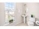 Cozy powder room with pedestal sink, and toilet at 707 Sutter Gate Ln, Morrisville, NC 27560