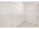 Bright, walk-in closet with carpet and white shelving offering ample storage solutions at 707 Sutter Gate Ln, Morrisville, NC 27560
