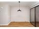 Dining room features a modern pendant light fixture and slider to back deck at 751 Benchmark Dr, Raleigh, NC 27615