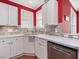 Bright kitchen showcasing white cabinets, marble countertops, and stone backsplash at 7634 Astoria Pl, Raleigh, NC 27612