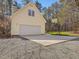 Charming yellow home with a two-car garage, basketball hoop, and a spacious driveway at 77 Double Oak Dr, Pittsboro, NC 27312