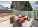 Backyard patio with a cozy seating area, landscaping, and a privacy fence at 812 Canyoncreek Ln, Fuquay Varina, NC 27526