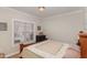 Bedroom with natural light from the window, dresser, and decor at 812 Canyoncreek Ln, Fuquay Varina, NC 27526