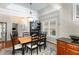 Cozy dining area featuring hardwood floors and a decorative hutch for storage and display, adjacent to a doorway at 812 Canyoncreek Ln, Fuquay Varina, NC 27526