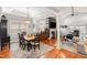 Dining area featuring a hardwood floors, table with seating for six, and a view of living room at 812 Canyoncreek Ln, Fuquay Varina, NC 27526