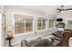 Bright exercise room with windows, treadmill, comfortable seating, and view to backyard at 812 Canyoncreek Ln, Fuquay Varina, NC 27526
