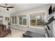 Exercise room with treadmill, windows providing a scenic view, and a comfortable seating area at 812 Canyoncreek Ln, Fuquay Varina, NC 27526