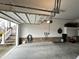 Spacious two car garage with brick accent wall and convenient EV charging station at 812 Canyoncreek Ln, Fuquay Varina, NC 27526
