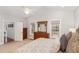 Bright main bedroom with a ceiling fan, large window and dresser with mirror at 812 Canyoncreek Ln, Fuquay Varina, NC 27526