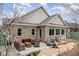 Charming outdoor patio featuring stone pavers, stylish furniture, and a meticulously landscaped backyard at 812 Canyoncreek Ln, Fuquay Varina, NC 27526