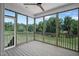 Relaxing back porch with a ceiling fan and full views of the lush, green backyard at 83 Nottoway Lane, Wendell, NC 27591