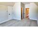 Bedroom with carpet, neutral walls, and access to a closet and other rooms in the home at 83 Nottoway Lane, Wendell, NC 27591