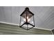 Stylish modern lantern adds a touch of sophistication to the home's inviting front porch at 83 Nottoway Lane, Wendell, NC 27591