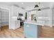 Modern kitchen with white cabinets, stainless steel appliances, and island at 83 Nottoway Lane, Wendell, NC 27591