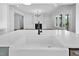 Open kitchen view with a white countertop island and view into the living room at 83 Nottoway Lane, Wendell, NC 27591