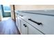 Close-up view of the kitchen's white cabinets and hardware at 83 Nottoway Lane, Wendell, NC 27591