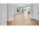 Spacious living room with hardwood floors, recessed lighting, a chandelier, and large windows at 83 Nottoway Lane, Wendell, NC 27591