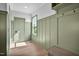 Green mudroom with paneled walls, a window providing natural light, and storage including a bench and hooks at 83 Nottoway Lane, Wendell, NC 27591