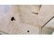 Modern tiled shower showcasing neutral tile and a decorative floor adding character and design at 83 Nottoway Lane, Wendell, NC 27591
