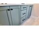 Close up of vanity cabinets with black hardware at 83 Nottoway Lane, Wendell, NC 27591