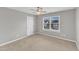 Neutral bedroom with carpet, a ceiling fan, and a large window at 8708 Poteat Dr, Wake Forest, NC 27587