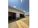 An exterior shot shows the frame of a new construction on a level lot, with construction materials in view at 975 Wilbon Rd, Holly Springs, NC 27540