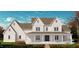 Inviting two-story home boasting a charming covered front porch and craftsman details at 975 Wilbon Rd, Holly Springs, NC 27540