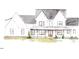 Charming home features a welcoming front porch, classic architectural details, and beautifully landscaped surroundings at 975 Wilbon Rd, Holly Springs, NC 27540