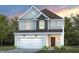 Charming two-story home showcasing a well-manicured lawn, attached garage, and appealing neutral-toned exterior at 1004 Freestone Rd, Durham, NC 27703