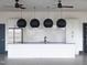 Modern kitchen with stainless steel appliances, white cabinets, subway tile backsplash and modern lighting at 1012 Channel Drop Lp, Zebulon, NC 27597