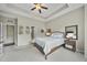 Carpeted bedroom with a large window, neutral walls and tray ceiling at 1016 Traditions Meadow Dr, Wake Forest, NC 27587