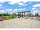 Enjoy a rooftop amenity deck with comfortable seating, an outdoor pergola, and views of the city at 110 N Corcoran St # 2304, Durham, NC 27701
