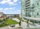 Enjoy a green rooftop deck featuring multiple seating options with views from this modern, high-rise building at 110 N Corcoran St # 2304, Durham, NC 27701