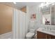 Clean bathroom featuring a shower-tub combo and a vanity at 110 N Corcoran St # 2304, Durham, NC 27701