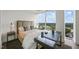 Bedroom with large windows overlooking the city and a convenient work desk at 110 N Corcoran St # 2304, Durham, NC 27701