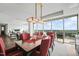 Open-concept living and dining room featuring stunning city views from expansive windows at 110 N Corcoran St # 2304, Durham, NC 27701