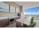 Resident kitchen featuring modern appliances, countertop seating, and large windows with beautiful city views at 110 N Corcoran St # 2304, Durham, NC 27701