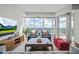 Bright living room with floor-to-ceiling windows showcasing city views at 110 N Corcoran St # 2304, Durham, NC 27701