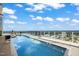 Rooftop swimming pool with lounge area, offering breathtaking city views for relaxation and enjoyment at 110 N Corcoran St # 2304, Durham, NC 27701