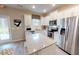 Bright kitchen featuring stainless steel appliances, granite countertops, and ample storage at 1105 Freestone Rd, Durham, NC 27703