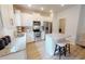 Well-lit kitchen with stainless steel appliances, granite countertops, and a cozy breakfast bar at 1105 Freestone Rd, Durham, NC 27703