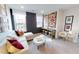 Inviting living room features a plush white couch with burgundy pillows and decor pieces on console table at 1105 Freestone Rd, Durham, NC 27703